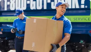 1-800-GOT-JUNK? junk removal team picking up junk